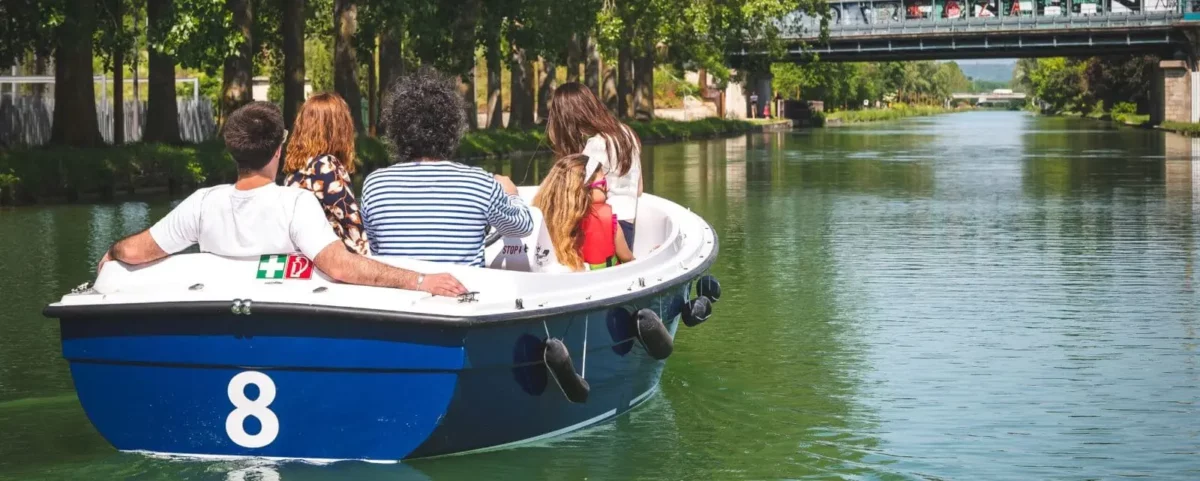 Leisurely boat ride on a calm Reims waterway, with tourists enjoying a relaxed aspect of a Reims.