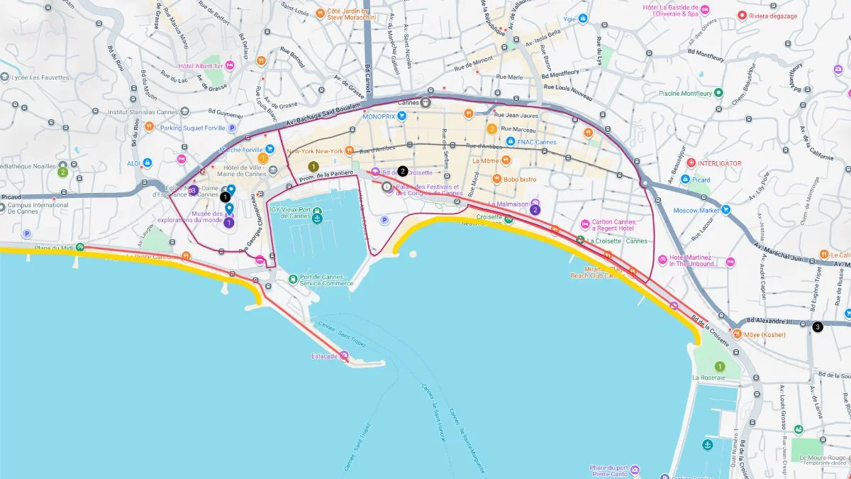Cannes tourist map showing a waterfront route along La Croisette and around the old port with stops near beaches, shopping streets, and the Palais des Festivals.