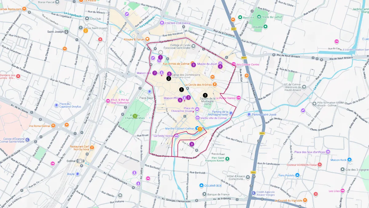 Colmar tourist map showing the historic city center with a pink outlined route and numbered sightseeing stops. Streets, landmarks, churches, museums, and the Little Venice area are labeled across the map, providing an overview of attractions and walking paths for visitors exploring Colmar.