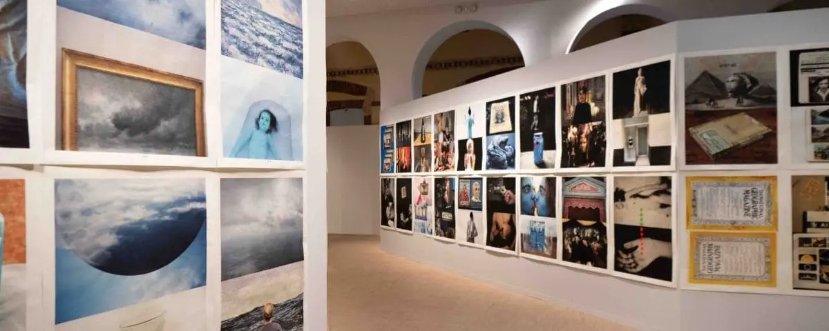 The interior of the Franciscaines Museum in Deauville, showcasing various artworks displayed on the walls.