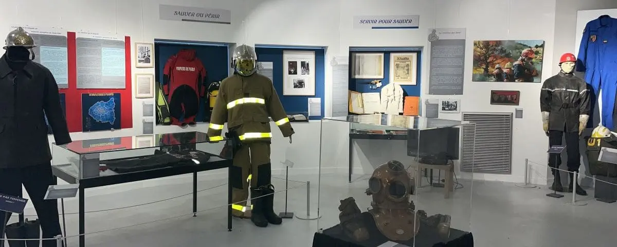 Exhibit at the Military Engineering Museum showcasing historical firefighting equipment, uniforms, and informative displays about rescue operations.