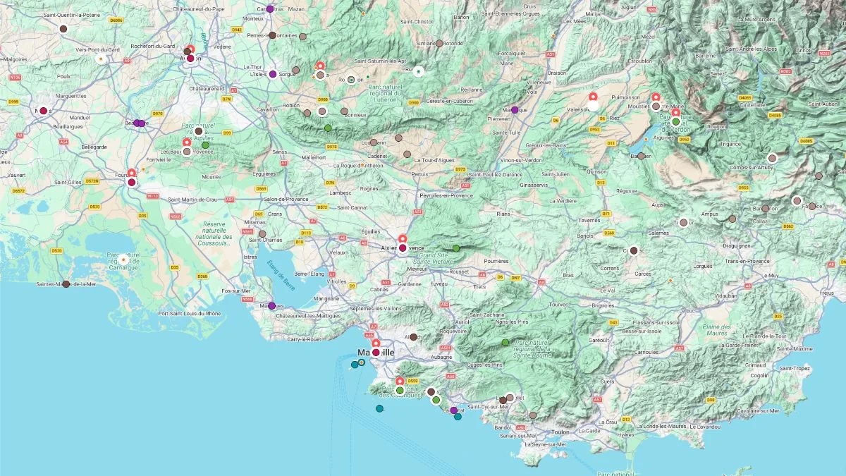 Provence tourist map showing a broad regional layout with multiple destinations marked across cities, countryside, and coastal areas including Marseille and surrounding villages.