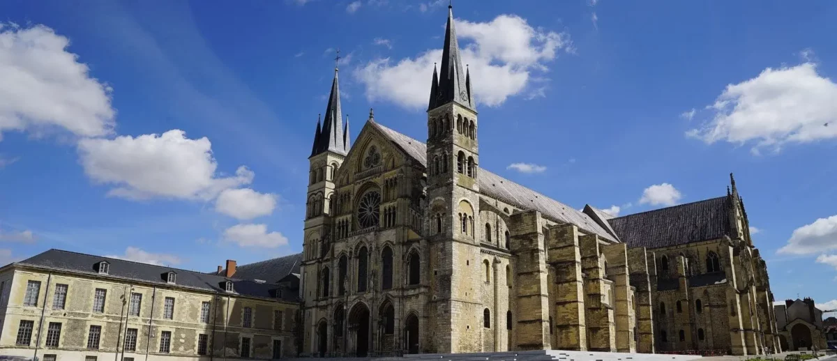 The majestic Saint Remi Basilica in Reims, an architectural marvel with its towering spires, providing a spiritual and historical dimension.