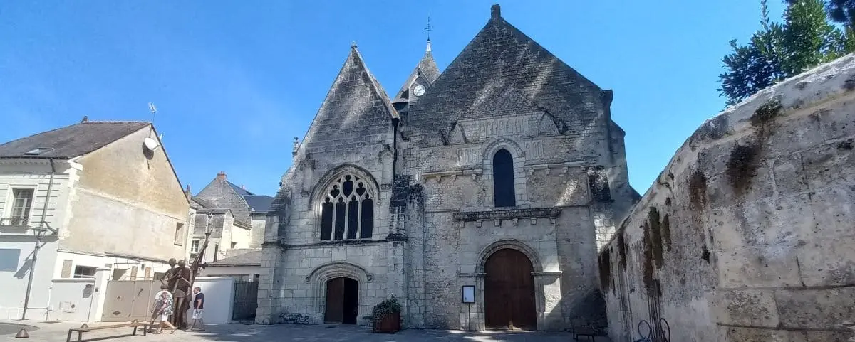 Exterior view of the Saint Symphorien Church in Azay-le-Rideau, featuring its stone facade and distinctive Gothic architectural elements.